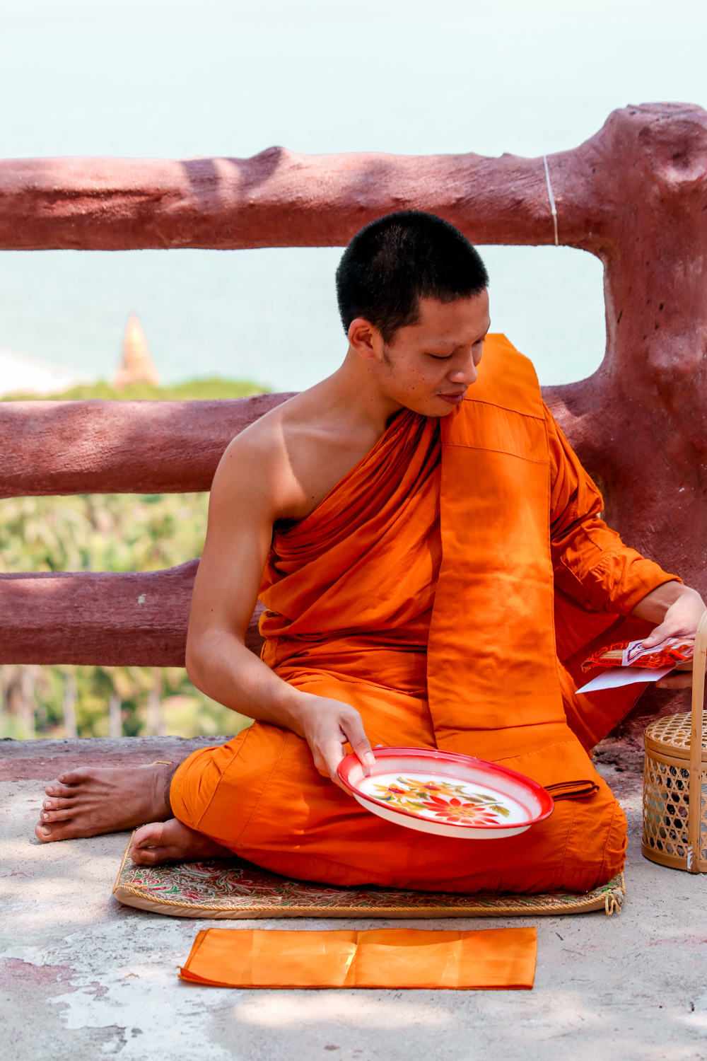 Monk receiving his offering in Thailand @howfarfromhome